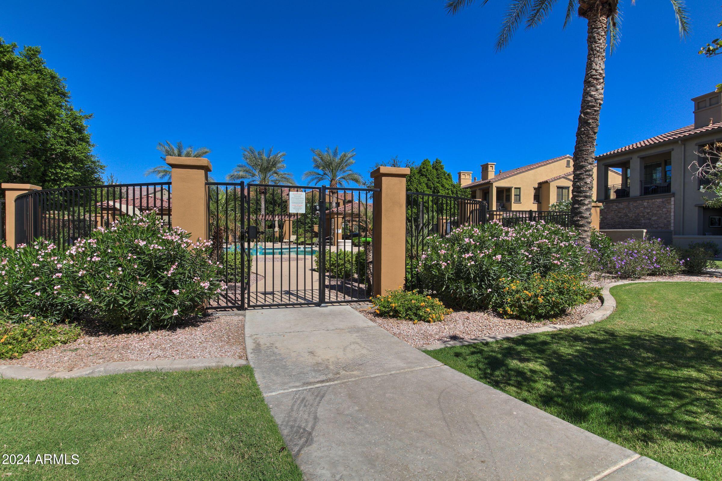 4777 South Fulton Ranch Boulevard, Unit 2066 Chandler, AZ 85248 - Photo 37 of 46 a view of a building with a yard