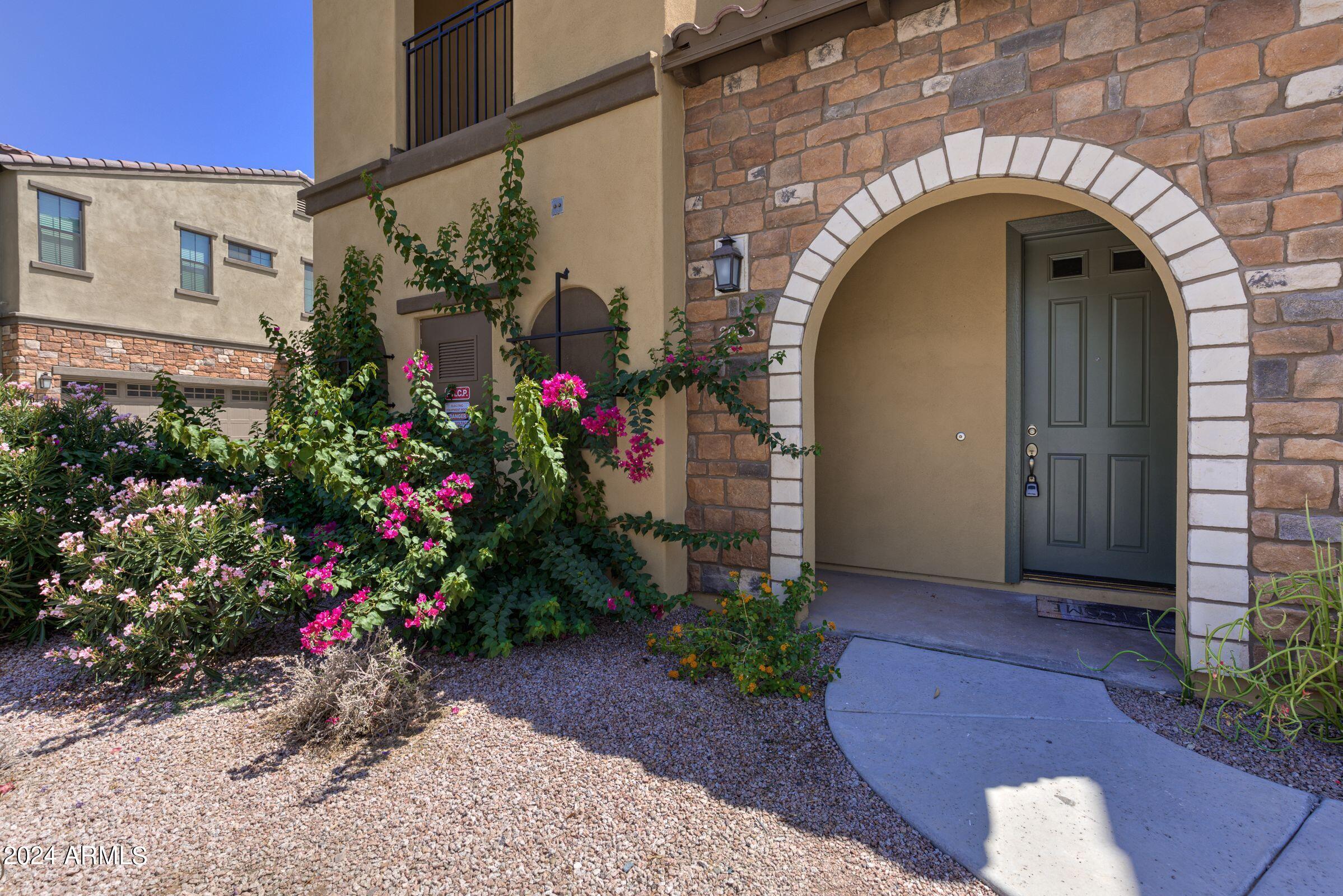 4777 South Fulton Ranch Boulevard, Unit 2066 Chandler, AZ 85248 - Photo 4 of 46 a view of entryway with flower pots