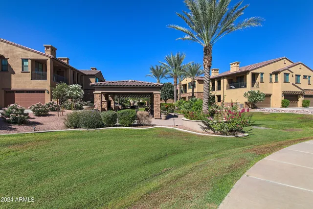 a view of an outdoor dining space with a table and chairs