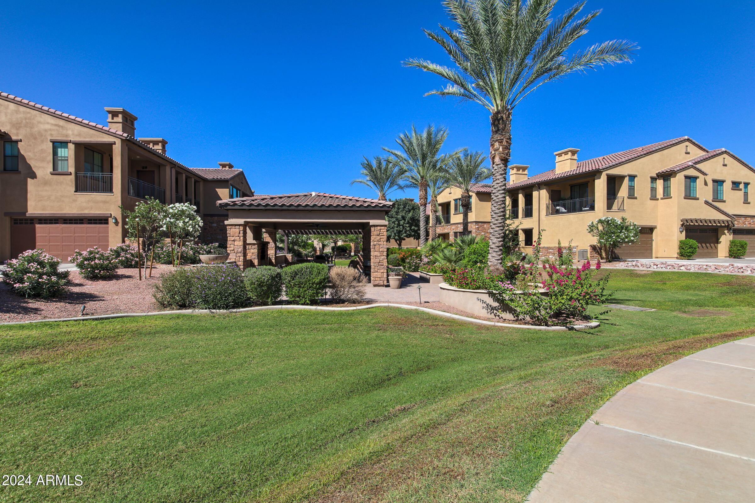 4777 South Fulton Ranch Boulevard, Unit 2066 Chandler, AZ 85248 - Photo 41 of 46 a front view of a house with a yard
