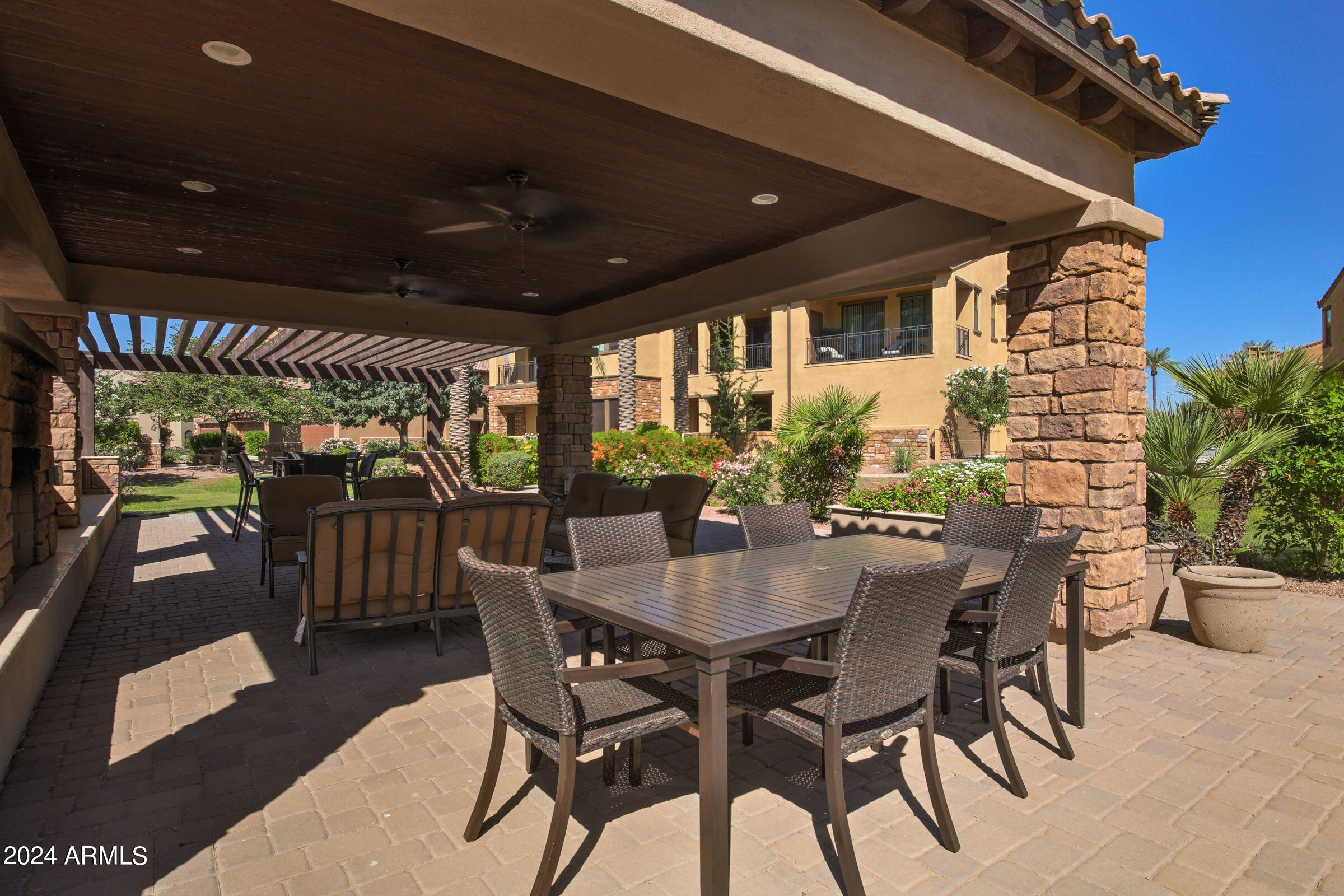 4777 South Fulton Ranch Boulevard, Unit 2066 Chandler, AZ 85248 - Photo 42 of 46 a view of an outdoor dining space with a table and chairs