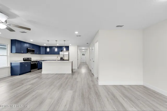 a view of kitchen with wooden floor