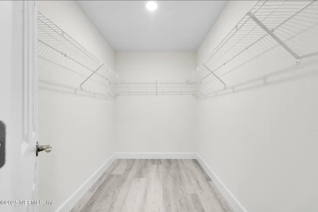 a view of a room with racks on the wall