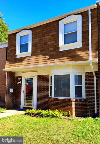 a front view of a house with yard