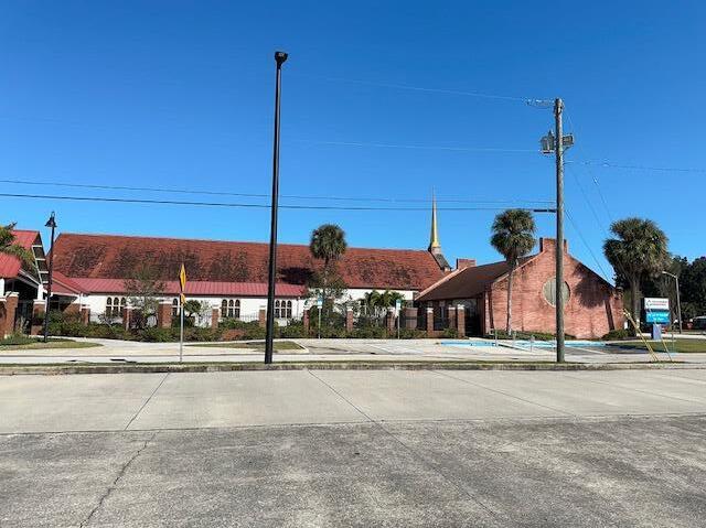 1714 Platt Street Melbourne, FL 32901 - Photo 3 of 5 a street sign on a sidewalk next to a road