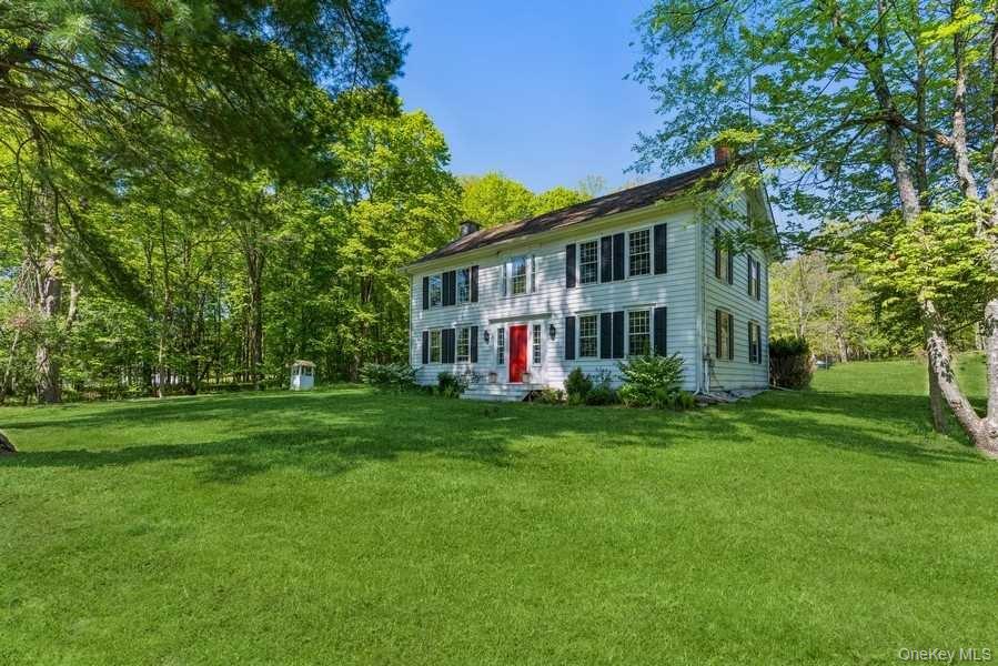 1141 Beekman Road Hopewell Junction, NY 12533 - Photo 2 of 36 a view of a house with a big yard and large trees