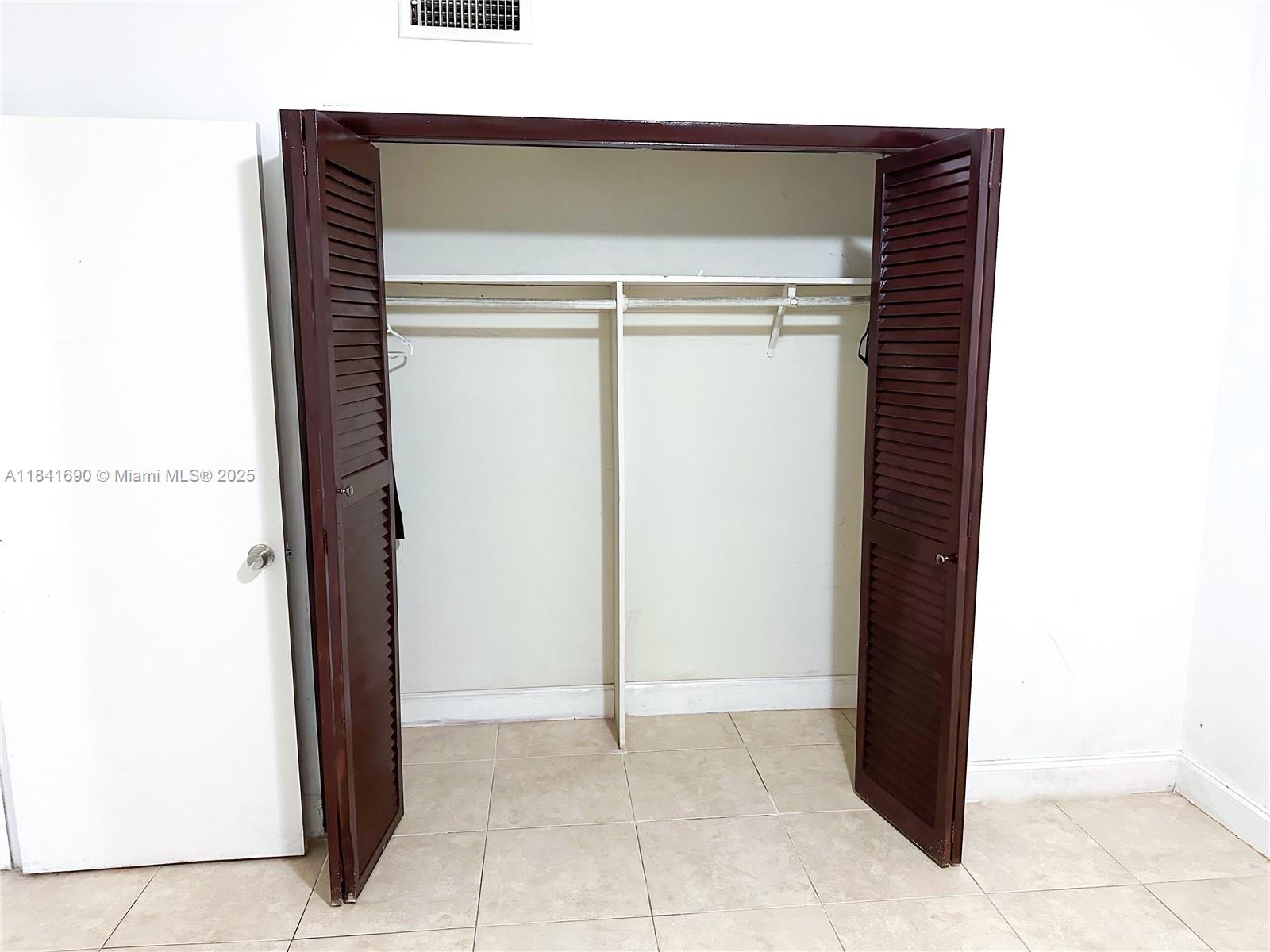 12275 Northeast 19th Avenue, Unit 5 North Miami, FL 33181 - Photo 13 of 13 a room with a door