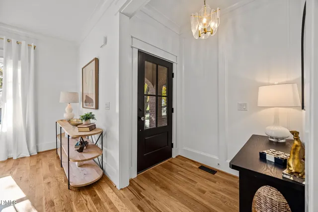 a bedroom with furniture and a wooden floor
