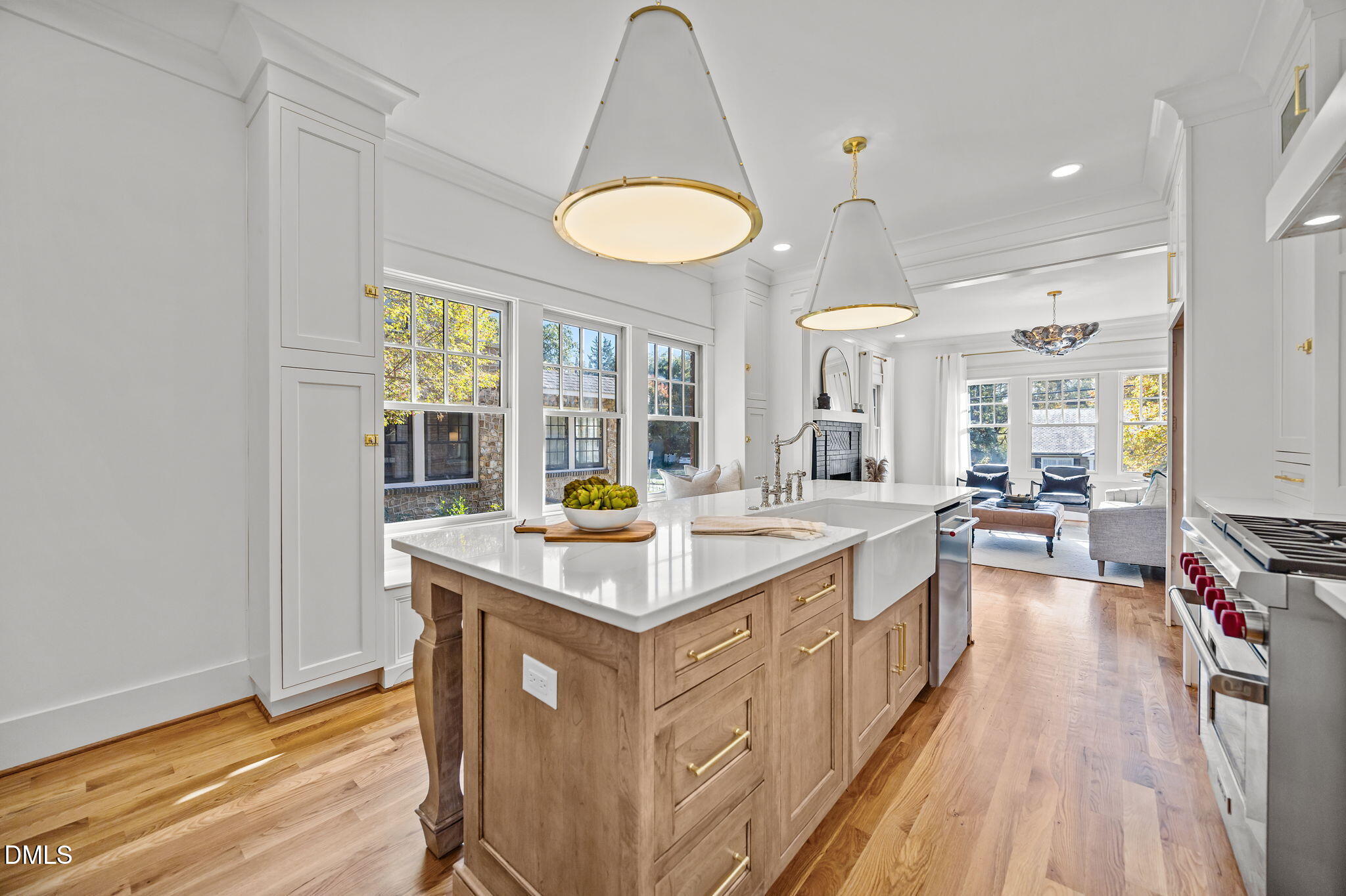 1710 Fairview Road Raleigh, NC 27608 - Photo 3 of 44 a kitchen with stove a sink dishwasher and a dining table with wooden floor