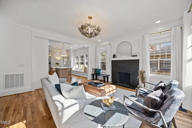 a living room with furniture fireplace and flat screen tv