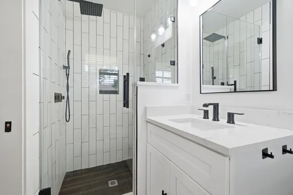 a bathroom with a sink and a mirror