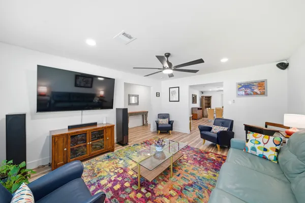a living room with furniture and a rug