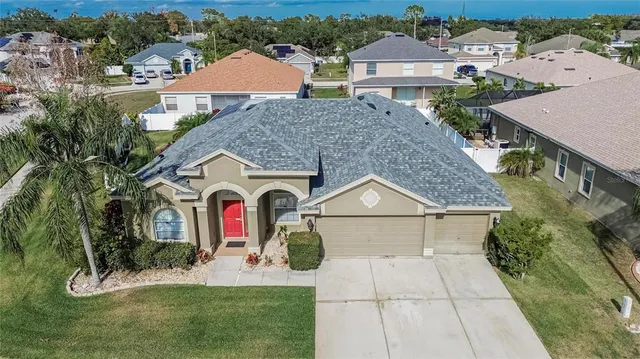 an aerial view of a house with a swimming pool