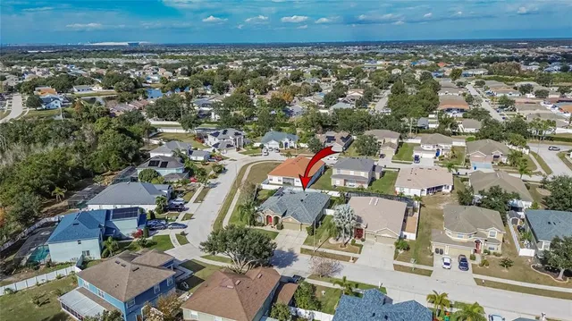 a balcony with outdoor seating and plants