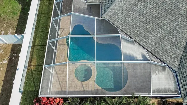 an aerial view of a house with a garden