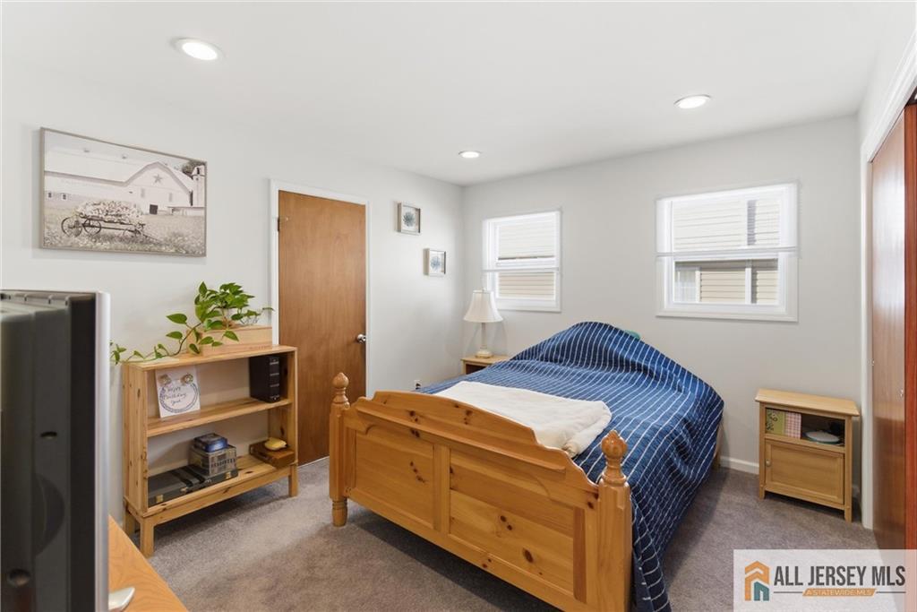 286 William Street Piscataway, NJ 08854 - Photo 12 of 23 a bedroom with a bed and a window