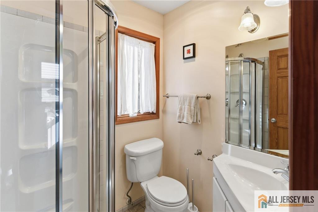 286 William Street Piscataway, NJ 08854 - Photo 13 of 23 a white toilet sitting next to a bathroom sink