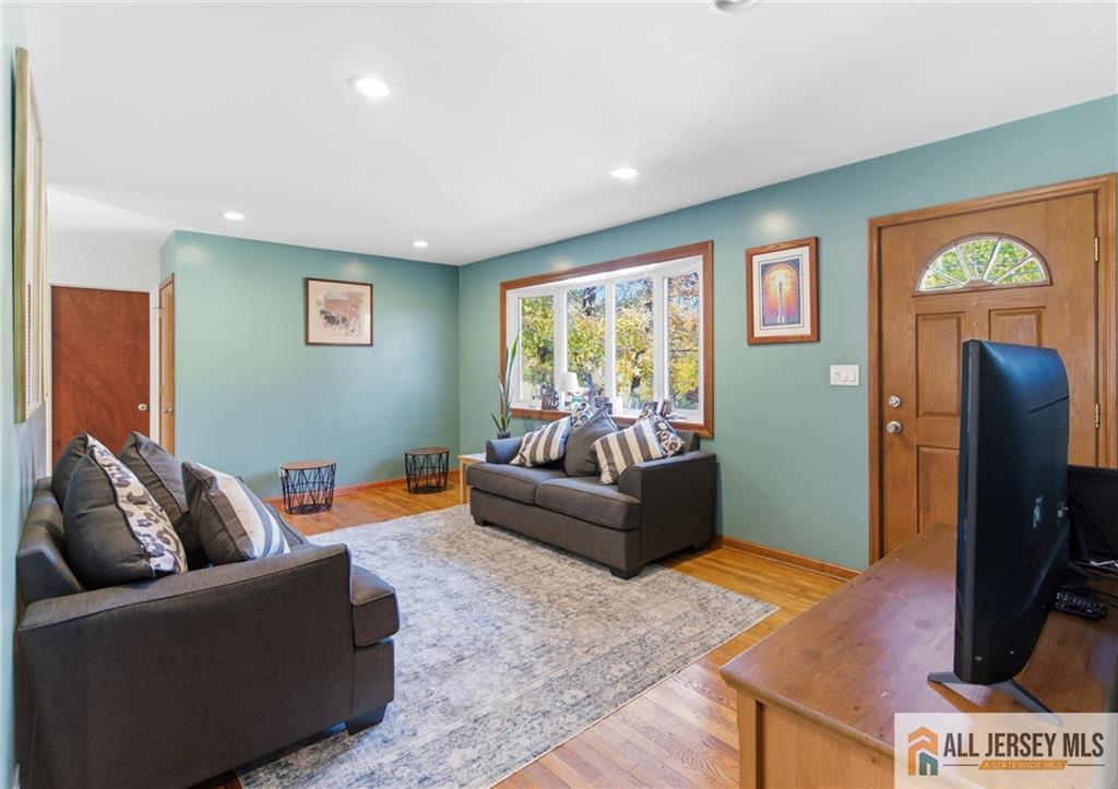 286 William Street Piscataway, NJ 08854 - Photo 6 of 23 a living room with furniture and a flat screen tv