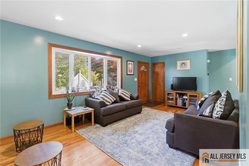 286 William Street Piscataway, NJ 08854 - Photo 7 of 23 a living room with furniture and a flat screen tv