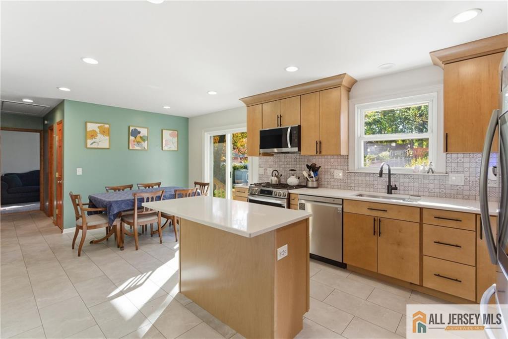 286 William Street Piscataway, NJ 08854 - Photo 10 of 23 a kitchen with microwave a sink and cabinets