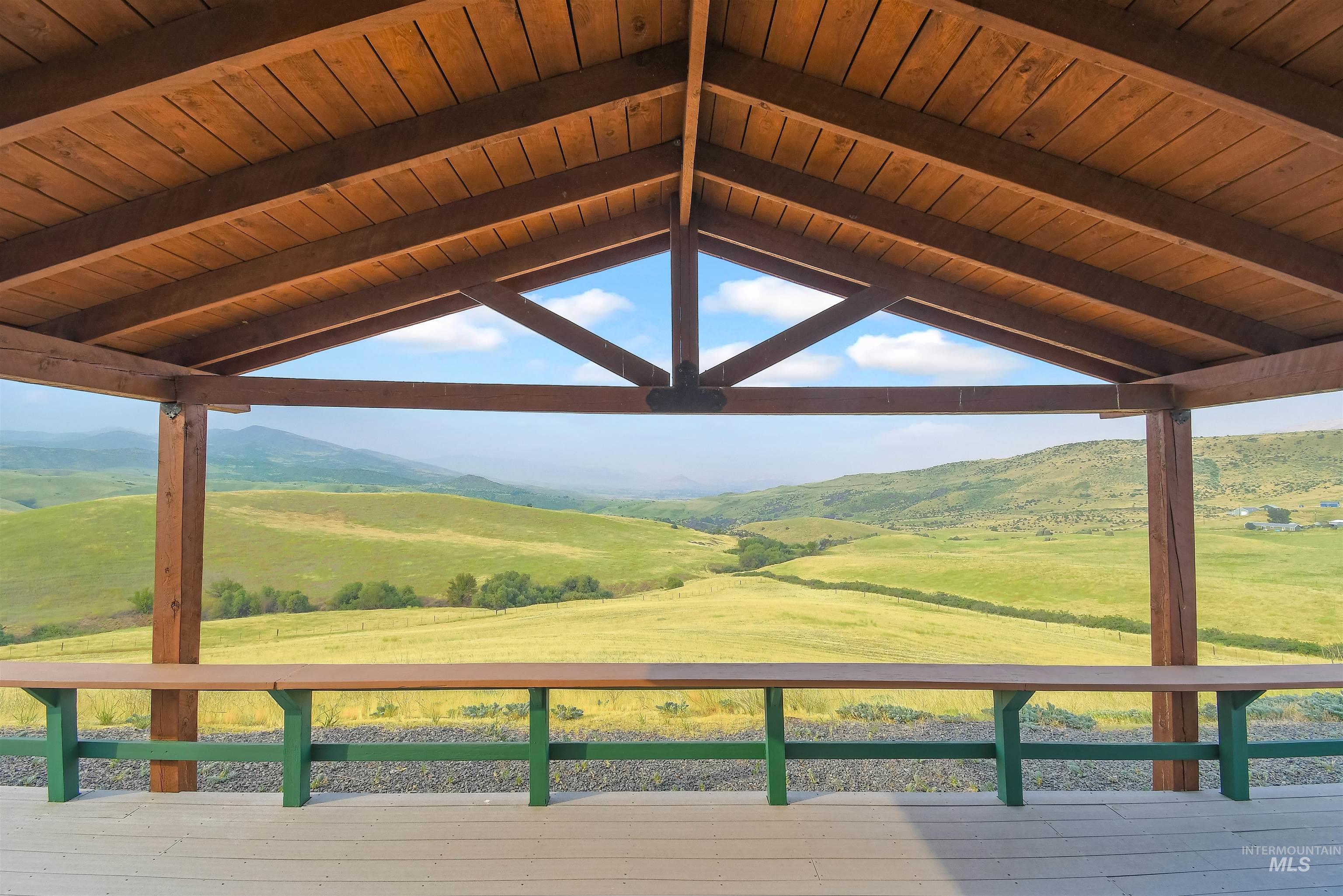 11375 Timber Butte Road Sweet, ID 83670 - Photo 19 of 49 Expansive outdoor covered patio featuring a pitched wood ceiling and exposed beams