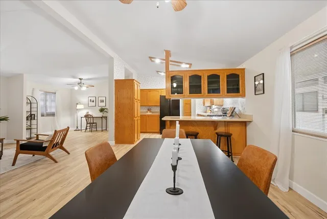 a view of a dining room with furniture and window
