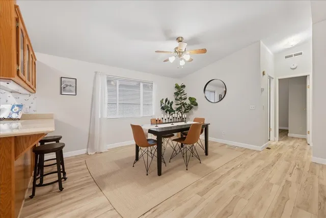 a kitchen with a refrigerator and a sink