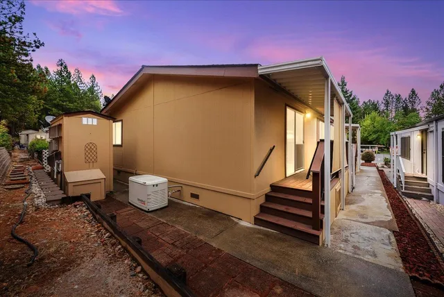 a view of a patio with table and chairs