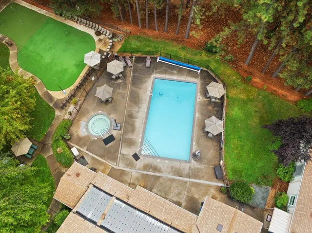 a backyard of a house with large trees
