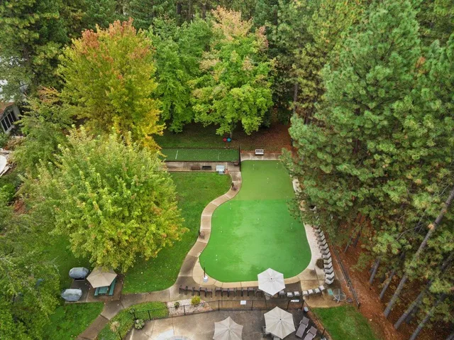 an aerial view of residential house with outdoor space and lake view
