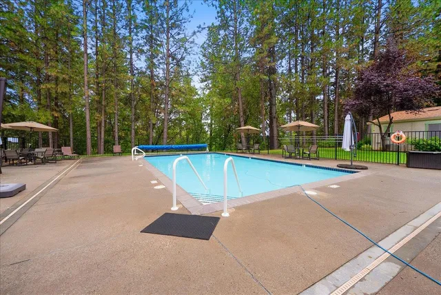 a view of a swimming pool with a patio