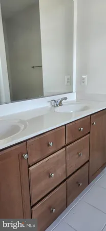 a bathroom with a sink and vanity