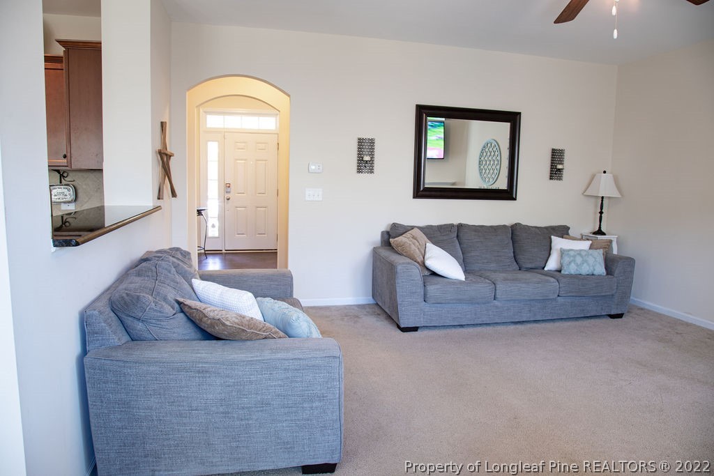 115 Stonehurst Drive Spring Lake, NC 28390 - Photo 12 of 50 a living room with furniture and a flat screen tv