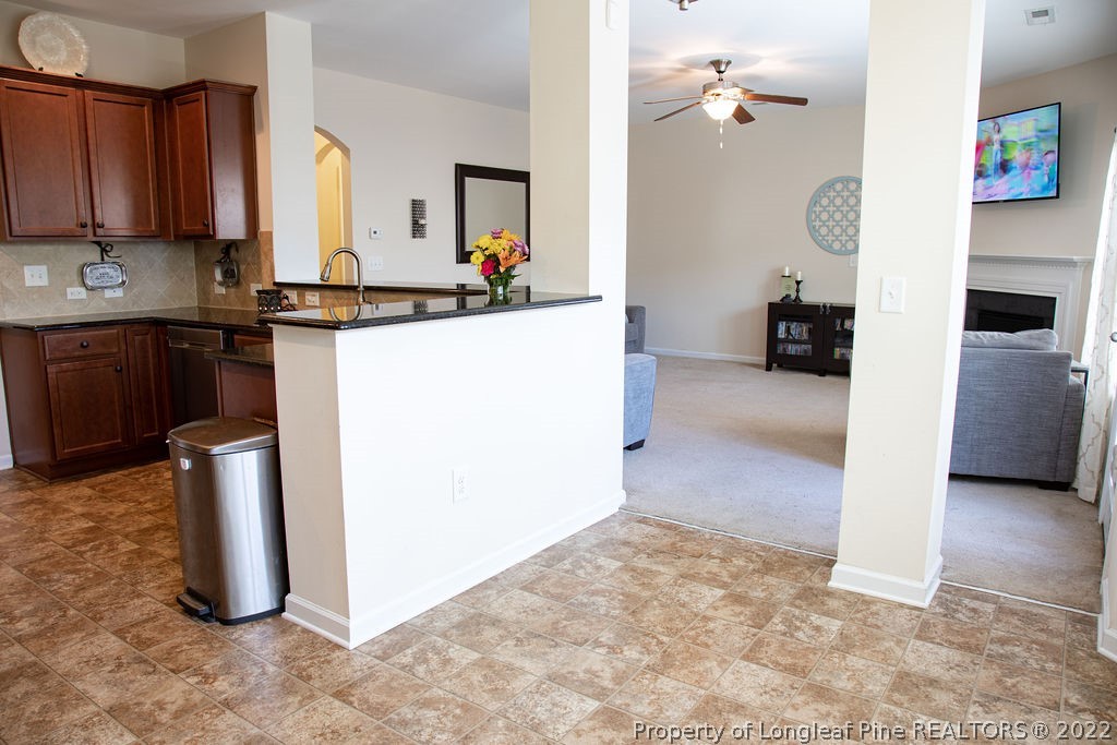 115 Stonehurst Drive Spring Lake, NC 28390 - Photo 15 of 50 a kitchen with refrigerator and cabinets