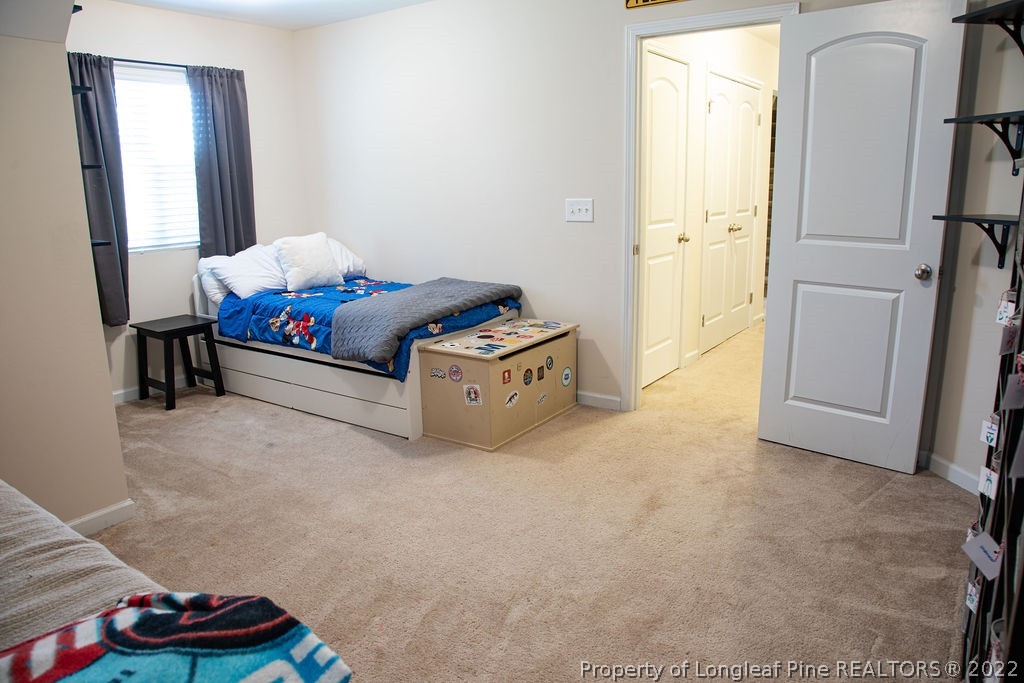 115 Stonehurst Drive Spring Lake, NC 28390 - Photo 27 of 50 a living room with furniture and a wooden floor