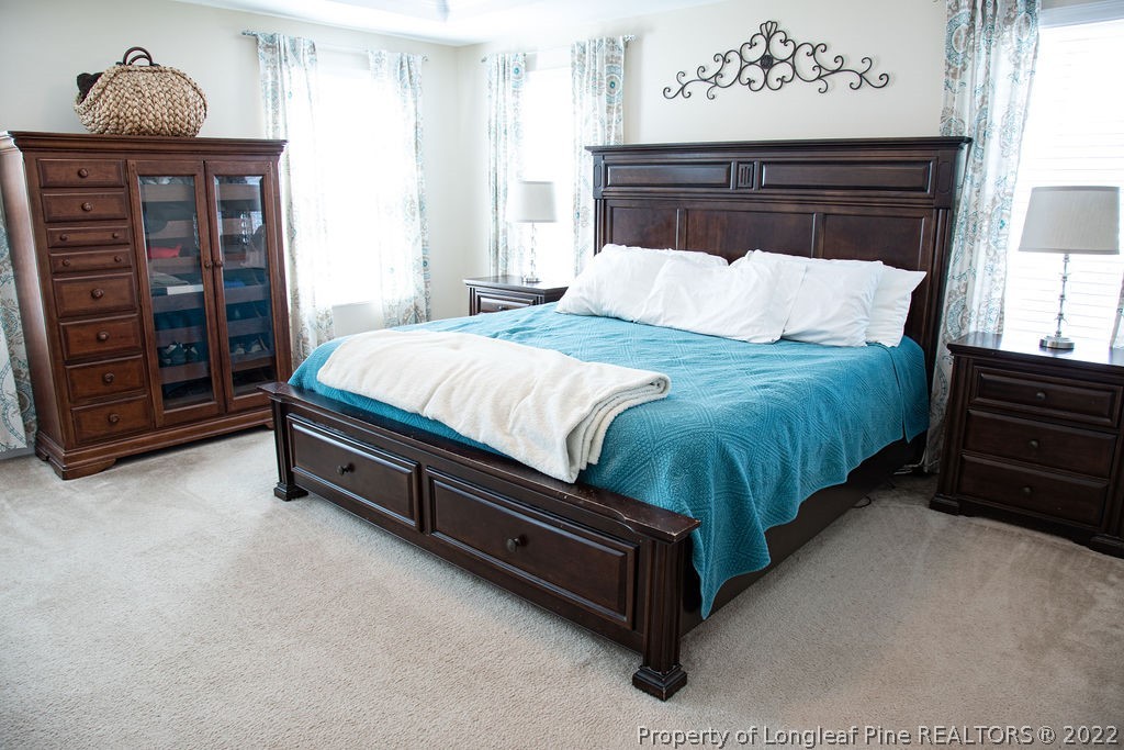 115 Stonehurst Drive Spring Lake, NC 28390 - Photo 29 of 50 a bedroom with a bed dresser and a window