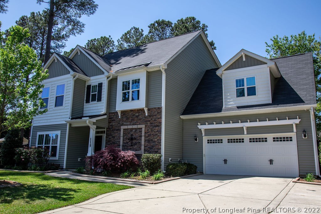 115 Stonehurst Drive Spring Lake, NC 28390 - Photo 3 of 50 a front view of a house with garden