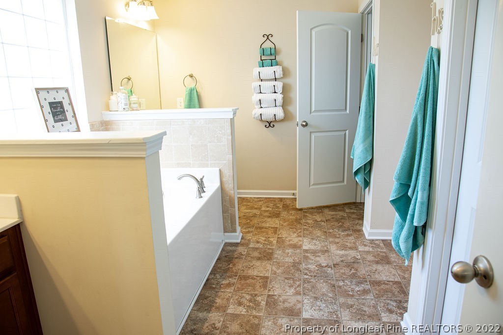 115 Stonehurst Drive Spring Lake, NC 28390 - Photo 31 of 50 a view of a bathroom from a hallway