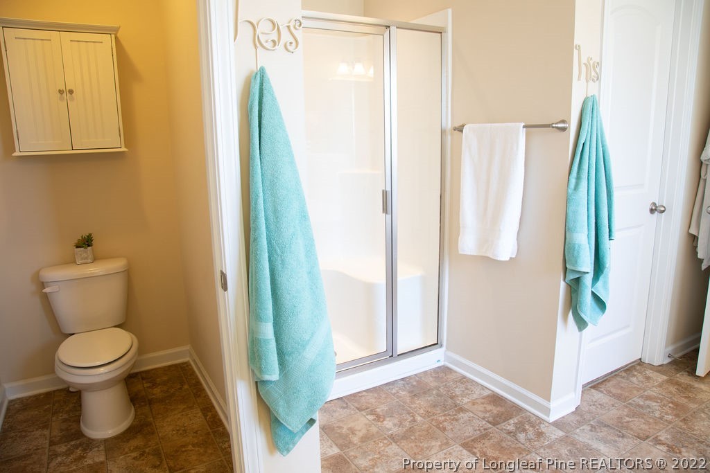 115 Stonehurst Drive Spring Lake, NC 28390 - Photo 34 of 50 a bathroom with a toilet and a shower