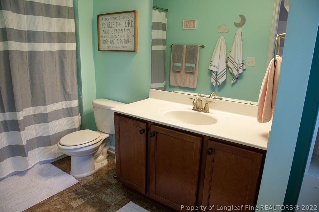 115 Stonehurst Drive Spring Lake, NC 28390 - Photo 39 of 50 a bathroom with a sink a toilet and shower