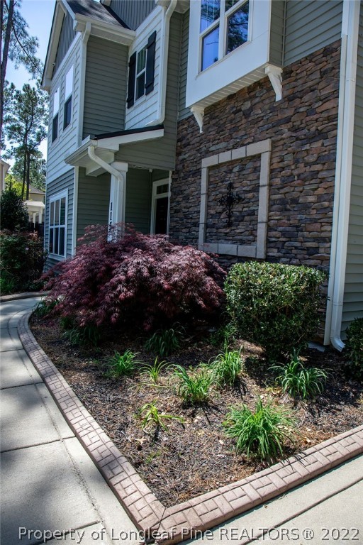 115 Stonehurst Drive Spring Lake, NC 28390 - Photo 4 of 50 a view of a house with a yard and plants