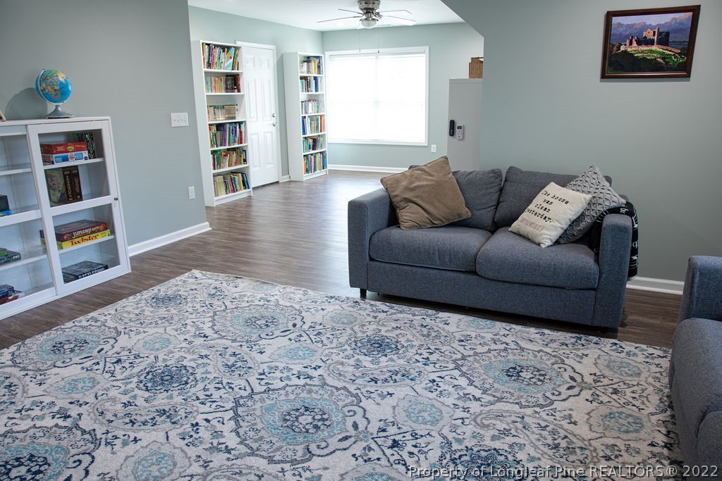 115 Stonehurst Drive Spring Lake, NC 28390 - Photo 41 of 50 a living room with furniture and a book shelf