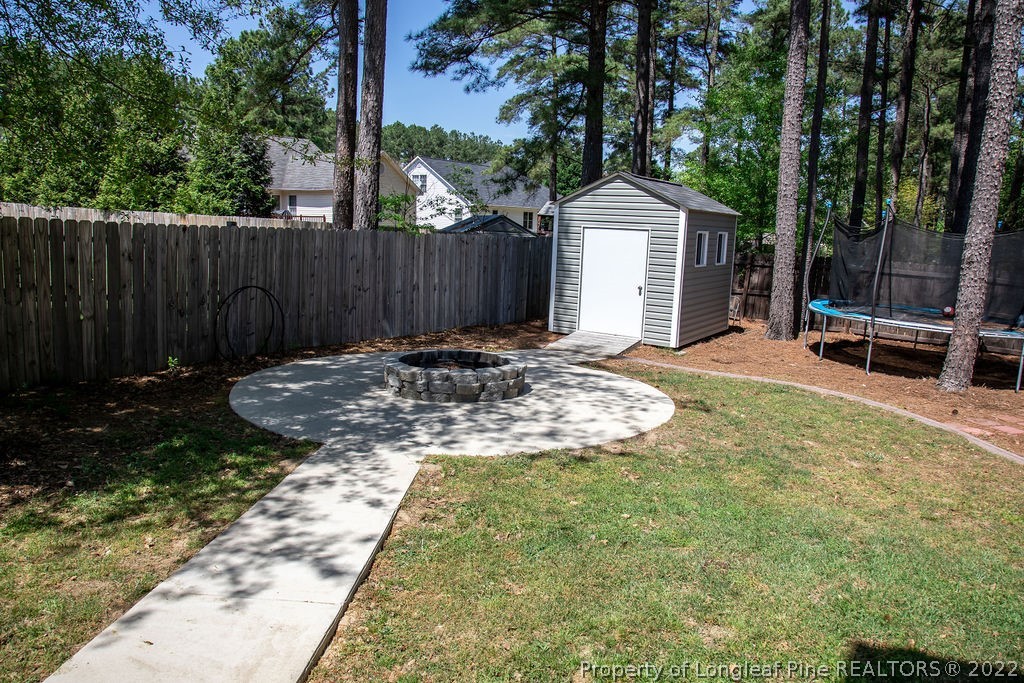 115 Stonehurst Drive Spring Lake, NC 28390 - Photo 48 of 50 a backyard of a house with yard and outdoor seating