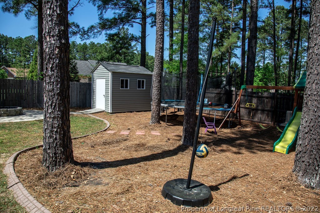 115 Stonehurst Drive Spring Lake, NC 28390 - Photo 49 of 50 a view of a house with backyard porch and sitting area