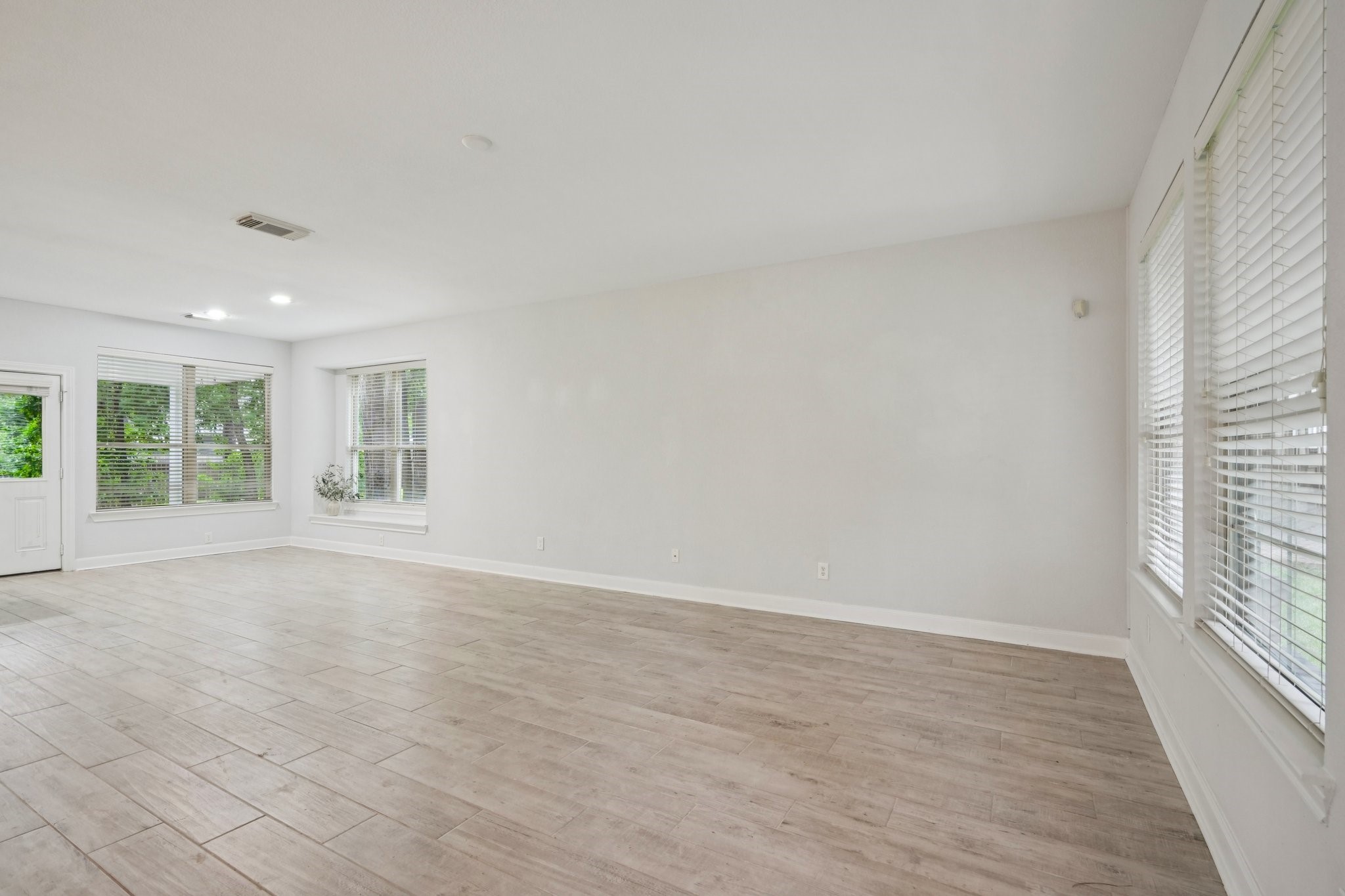 90 Panterra Way Spring, TX 77382 - Photo 15 of 43 wooden floor in an empty room with a window