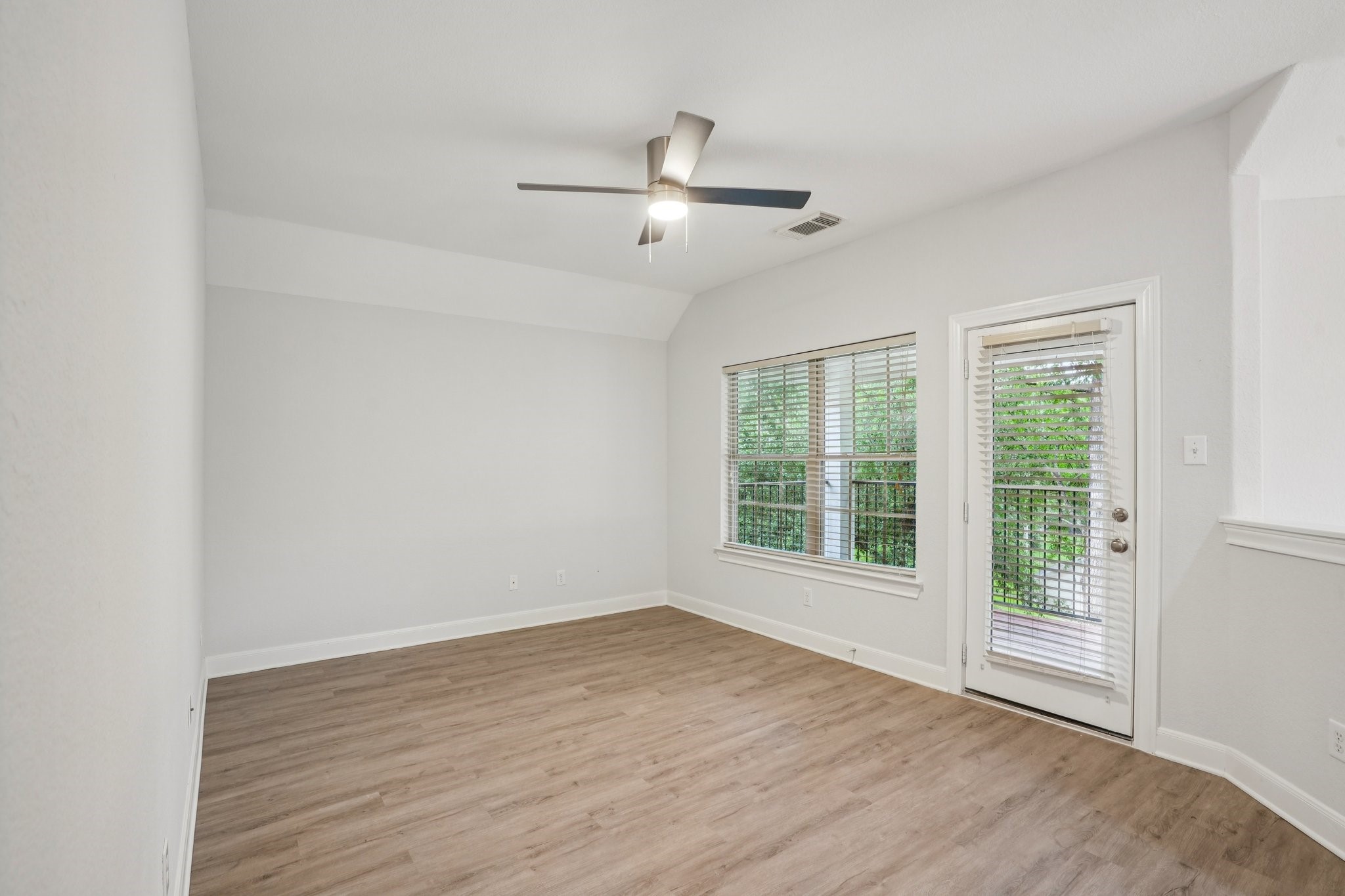 90 Panterra Way Spring, TX 77382 - Photo 21 of 43 an empty room with wooden floor and windows