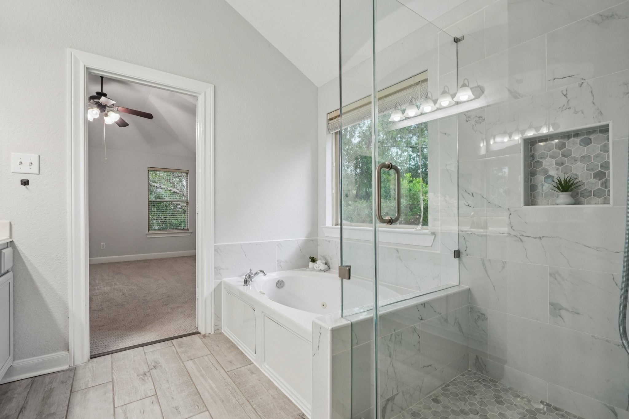 90 Panterra Way Spring, TX 77382 - Photo 29 of 43 a bathroom with a bathtub and a shower