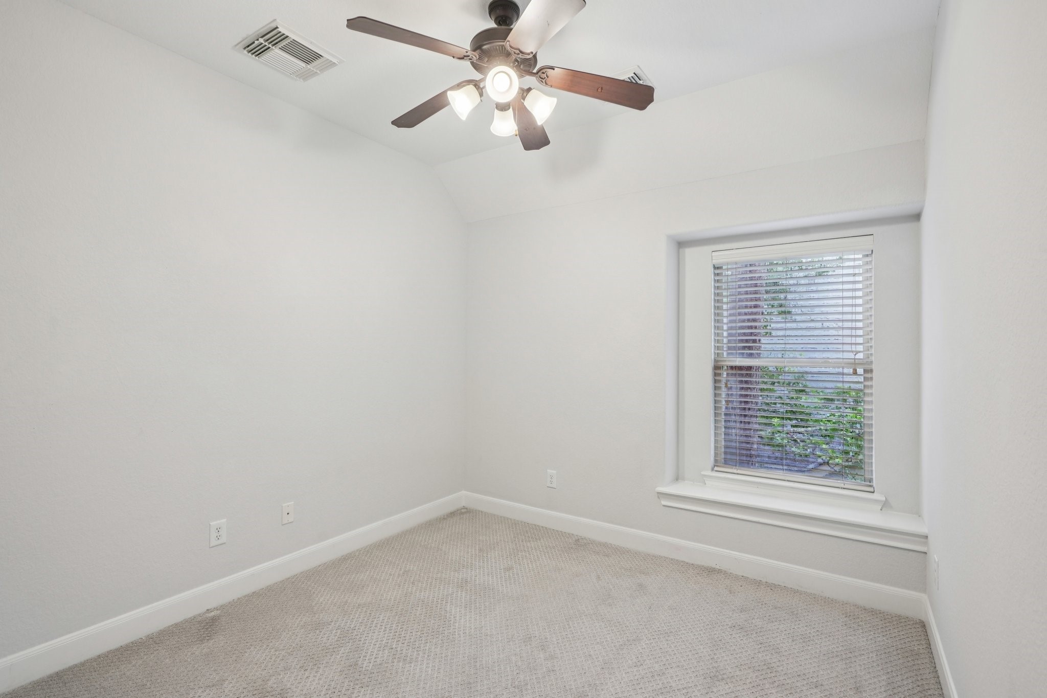 90 Panterra Way Spring, TX 77382 - Photo 31 of 43 an empty room with a window and a fan