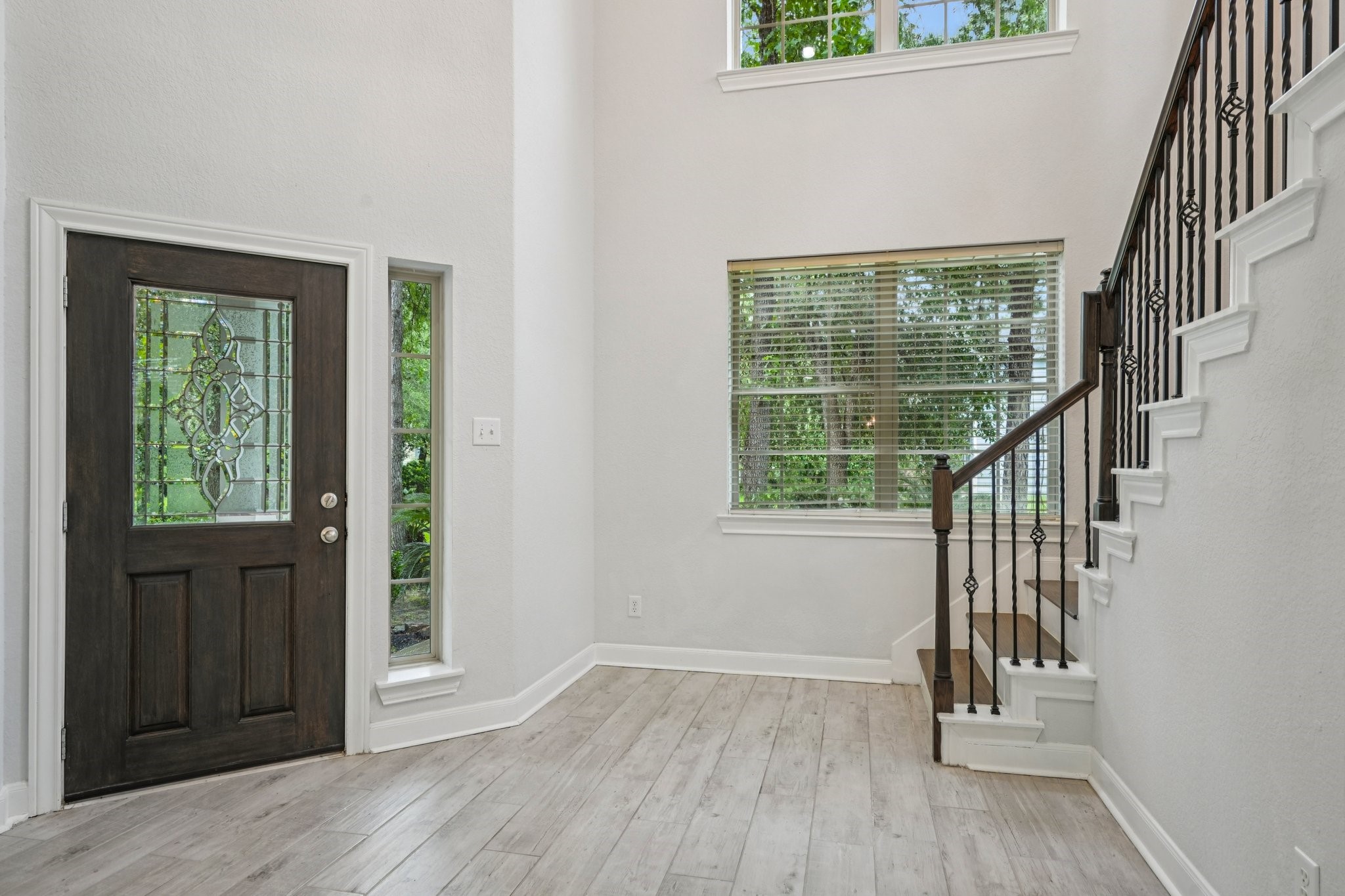 90 Panterra Way Spring, TX 77382 - Photo 7 of 43 an empty room with wooden floor and windows
