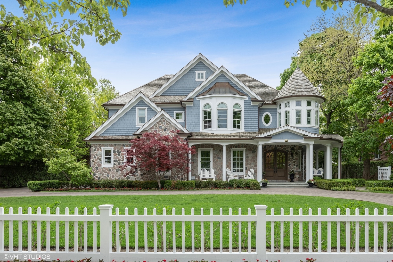 a front view of a house with a garden